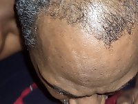 A lovely young girl is performing oral sex