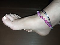 Seductive middle-aged woman dons an enticing undergarment