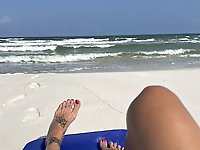 A well-endowed older woman is pleasuring herself