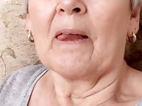 Insatiable dame is taking off her bra for a photoshoot